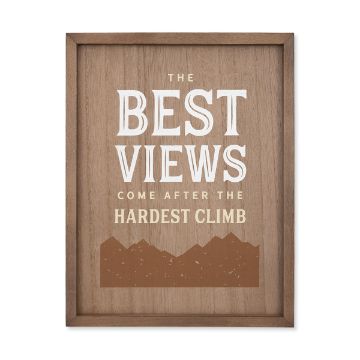 Show details for The Best Views A framed wooden sign with a motivational quote that reads, "The Best Views Come After the Hardest Climb." The text is in white and gold. At the bottom of the sign is an illustration of mountain peaks. This design features Chalk Couture's "transfer" product.