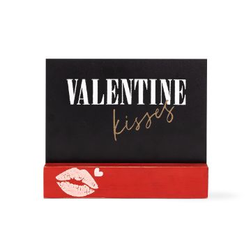 Show details for Valentine Kisses A decorative sign with a black rectangular top and a red base. The top part has "VALENTINE kisses" written in white and gold cursive. The red base is adorned with a kiss mark, and a small white heart is placed above the kiss mark.