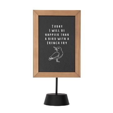 Show details for Bright White Paste Single A small, rectangular sign with a wooden frame and a black stand. The sign has a black background and white text that reads, "TODAY I WILL BE HAPPIER THAN A BIRD WITH A FRENCH FRY" above a simple line drawing of a bird holding a fry. The design was created using Chalk Couture paste.