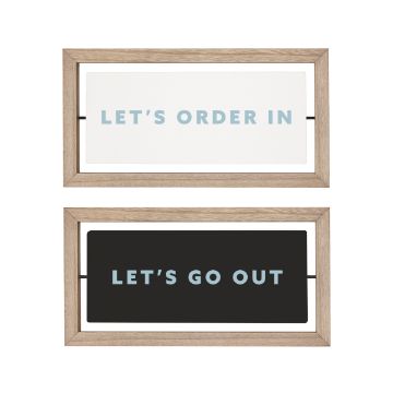 Show details for Ocean Mist Paste Single Two framed signs are stacked vertically. The top frame has a white background with blue text saying "LET'S ORDER IN." The bottom frame has a black background with blue text saying "LET'S GO OUT." Both frames have light wooden borders. These designs are created using Chalk Couture paste.