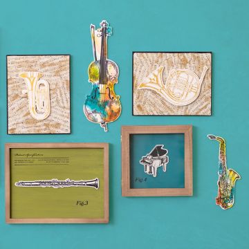 Show details for Violin Chalkable Shapes (1 Piece) A teal wall with framed artwork featuring various musical instruments. The frames hold images of a trumpet, violin, French horn, clarinet, piano, and saxophone. Some instruments are painted in vibrant colors and the backgrounds include sheet music patterns.