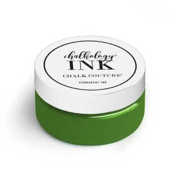 Show details for Meadow Ink A small container of ink by Chalk Couture is shown. The container has a white lid with black text and a green base, indicating the color of the permanent ink inside.