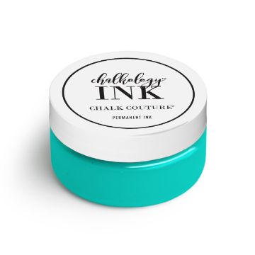 Show details for Couture Teal Ink A small, round container with a white lid and a turquoise body. The label on the lid reads "ink, Chalk Couture, PERMANENT INK." The container appears to be a jar of permanent ink for crafting or creative projects.