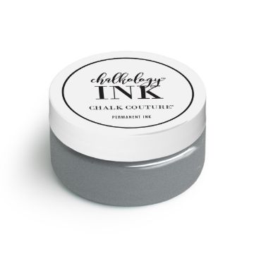Show details for Shimmer Silver Ink A small, round jar of ink by Chalk Couture with a white lid. The label on the lid reads "Chalkology Ink, Chalk Couture, Permanent Ink." The jar contains a grey-colored ink.