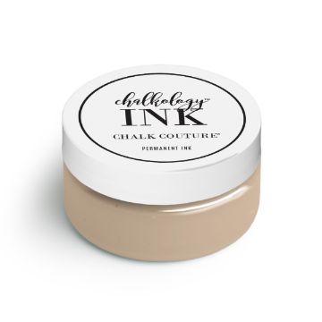 Show details for Dune Ink A small, round container of Chalk Couture ink is shown with a white lid. The label on the lid features the brand name and product type in black text. The container is filled with beige-colored ink.