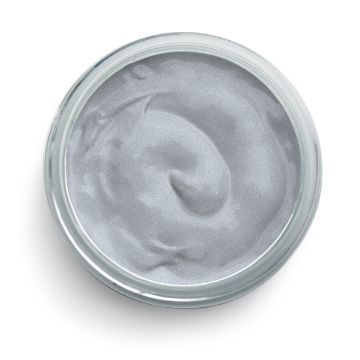 Show details for Shimmer Silver Paste A top-down view of an open glass jar filled with a smooth, metallic silver-colored paste from Chalk Couture. The substance inside has a swirled texture, indicating it has been stirred or used. The jar is placed against a plain white background.