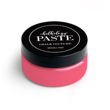 Show details for Couture Coral Paste A round jar of paste from Chalk Couture. The jar is predominantly pink with a black lid. The label on the lid reads "paste, Chalk Couture, Washable Paste." The jar is shown against a white background.