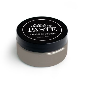 Show details for Storm Paste A round container labeled "paste" from Chalk Couture. The product features a black lid with white text and a light gray body, indicating it is a washable paste. The container is isolated on a white background.