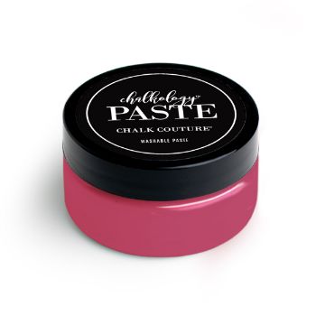 Show details for Raspberry Sorbet Paste A small container of paste from Chalk Couture. The jar has a black lid with a label that reads "Chalkology Paste Chalk Couture Washable Paste" in white text. The container itself is a vibrant pink color.
