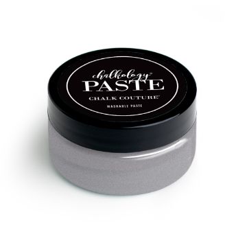 Show details for Shimmer Silver Paste A round container of paste by Chalk Couture with a black screw-on lid and a gray body. The label on the lid reads "Chalkology Paste, Chalk Couture, Washable Paste" in white text on a black background.