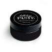 A small, black cylindrical container labeled "Chalk Couture paste" on the lid. The container has a sleek, modern design and is used for crafting and creating chalk-style art.