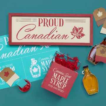 Show details for Proud Canadian A decorative sign reading "Proud Canadian" with a maple leaf is surrounded by a red box labeled "Chalk Couture transfer," two syrup bottles, gift tags, and a blue informational card about Canadian maple syrup, all set against a teal background.