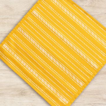 Show details for Angled Stripes Pattern A square yellow placemat with diagonal white stripes is placed on a light wood surface. The pattern consists of evenly spaced thin stripes creating a simple geometric design.
