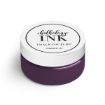 A small white container with a purple base, labeled "Chalkology Ink" by Chalk Couture. The lid is marked with "PERMANENT INK." The container holds purple permanent ink.