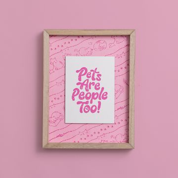 Show details for Pets Are People A framed picture on a pink background with the text "Pets Are People Too!" in bold, playful pink lettering. The background features a pattern of small, cute animal doodles.