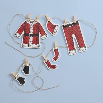 Show details for Santa's Clothesline Illustration of Santa Claus clothes hanging on a rope against a light blue background. Includes a red and white coat, pants, hat, mittens, and socks, all held by wooden clothespins.