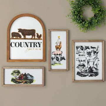 Show details for Animal Farm A wall with five framed country-themed artworks: one has farm animals and the words "Country before it was cool," another features a woman on a llama, a third shows multiple farm animals, and one depicts a house with trees nearby. A green plant decorates the corner.