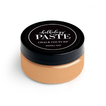 Show details for Shimmer Peach Cobbler Paste (En Vogue) A small, round container with a black lid labeled "Chalkology Paste, Chalk Couture, Washable Paste." The container is filled with a peach-colored paste.
