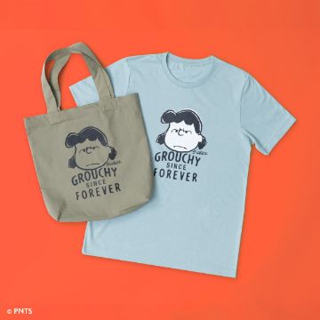 Show details for Peanuts - Grouchy Forever A blue t-shirt and a beige tote bag both feature a cartoon character with the text "Grouchy Since Forever." The items are displayed on an orange background.