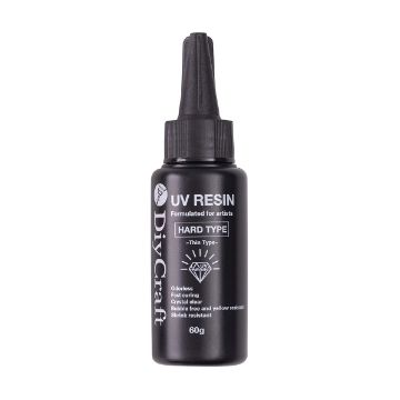 Show details for UV Resin Black bottle of DIY Craft UV Resin, Hard Type, 60g. Features: odorless, fast curing, crystal clear, bubble-free, yellow-resistant, shrink-resistant. White text and icons on the bottle. Black pointed cap.