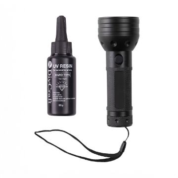 Show details for UV Resin & Flashlight Bundle A bottle of black UV resin labeled "Hard Type" next to a black flashlight with a textured grip and wrist strap on a white background.