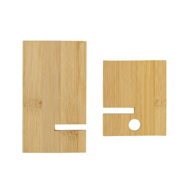 Two rectangular wooden pieces with a smooth finish are positioned side by side. The piece on the left has a notch, while the piece on the right has a notch and a circular hole. Both have a natural wood grain texture.