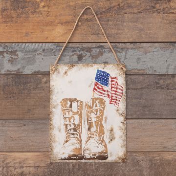 Show details for Veteran A rustic sign hangs on a wooden wall, featuring an illustration of a pair of worn combat boots and a waving American flag in the background.
