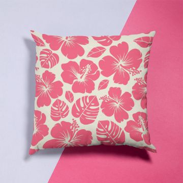Show details for Hibiscus Pattern Square pillow with a cream background featuring a pink hibiscus flower and leaf pattern, placed on a diagonal split background of light gray and pink.