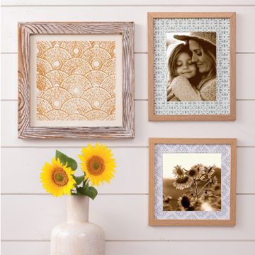 Show details for Pottery Patterns A white vase with two sunflowers sits below three framed pictures on a white shiplap wall: patterned art, a sepia photo of a woman with a child, and a sepia photo of sunflowers.