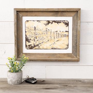 Show details for Country Scene Encore A wooden table with a small potted plant and car keys sits in front of a white wall. Above, a rustic wooden frame displays an illustrated landscape with a fence and clouds.
