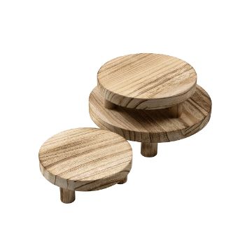 Show details for Riser (3-Pack) Three round wooden display stands of varying heights and sizes are arranged together on a white background. Each stand has three short legs and a smooth, natural wood grain finish.