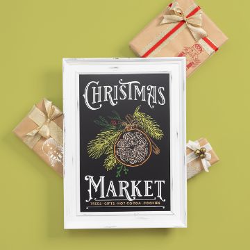 Show details for Christmas Market Framed "Christmas Market" sign with festive pine and orange illustration, surrounded by three gift-wrapped presents on a light green background.