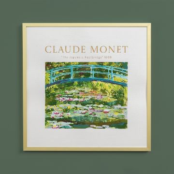 Show details for The Japanese Footbridge A framed print of Claude Monet’s “The Japanese Footbridge” (1899) featuring a blue bridge over water lilies, with Monet’s name and the artwork title above, set against a green wall.