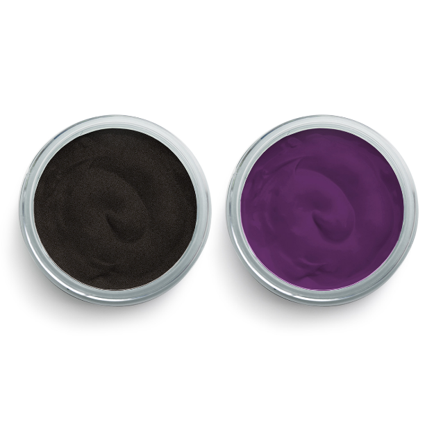 Two round containers, one filled with black-colored cream or gel and the other with purple-colored cream or gel, viewed from above on a white background.