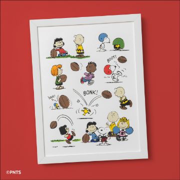 Show details for Peanuts - Football A framed cartoon illustration of Peanuts characters playing with footballs, including Charlie Brown, Snoopy, Lucy, and others, on a white background with a red wall behind the frame.
