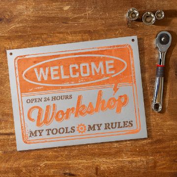 Show details for Silver Metallic Sign (8½" x 11") A metal sign on a wooden surface reads: "Welcome. Open 24 hours. Workshop. My tools, my rules." Next to it are a ratchet wrench and three socket attachments.