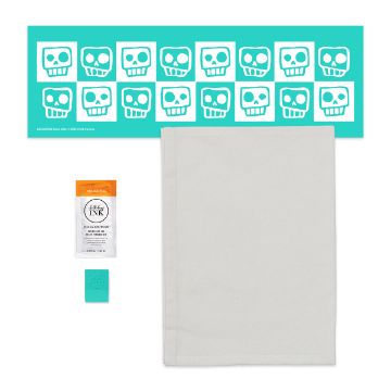 Show details for Bone-afide Try-Me Kit A craft kit includes a teal stencil with white cartoon skulls, a white cloth, an orange tube of ink, and a teal squeegee tool, all arranged neatly on a white background.