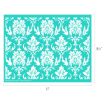 A rectangular stencil with a white damask floral pattern on a teal background, measuring 8.5 inches tall by 11 inches wide.