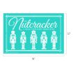 A teal poster with white illustrations of five nutcracker soldiers, ornate borders, and text reading "The Nutcracker: A Sugar Plum Fairy Production." Dimensions are labeled as 18 inches wide by 12 inches tall.
