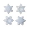 Four white, plastic, snowflake-shaped molds are arranged in a square on a plain white background. Each mold has a unique snowflake pattern with six points.