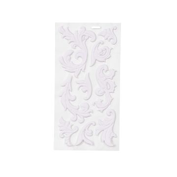 Show details for Regency Artisan Add-Ons A white sheet displaying several ornate, decorative scrollwork embellishments with a floral and leaf design, arranged in various shapes and sizes.