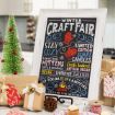 A festive kitchen scene with a decorated mini Christmas tree, wrapped gifts, and a framed chalkboard sign advertising a winter craft fair with cozy items, soaps, candles, baked bread, and cocoa by the campfire.
