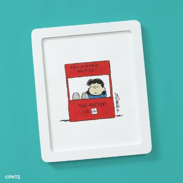 Show details for Peanuts - Doctor Lucy A framed cartoon drawing shows a girl with black hair sitting at a red booth labeled "PSYCHIATRIC HELP 5¢" and "THE DOCTOR IS IN" against a teal background.