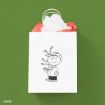 A white gift bag with a black sketch of a smiling boy holding a small, sparse Christmas tree, filled with white and red tissue paper, against a green background.