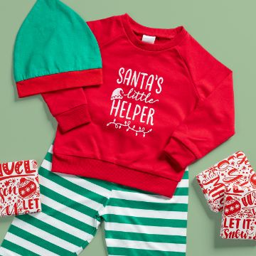 Show details for Debbie - Santa's Little Helper A festive children's outfit with a red sweatshirt reading "Santa's little helper," green and white striped pants, a green hat with a red brim, and Christmas-themed gift boxes on a green background.