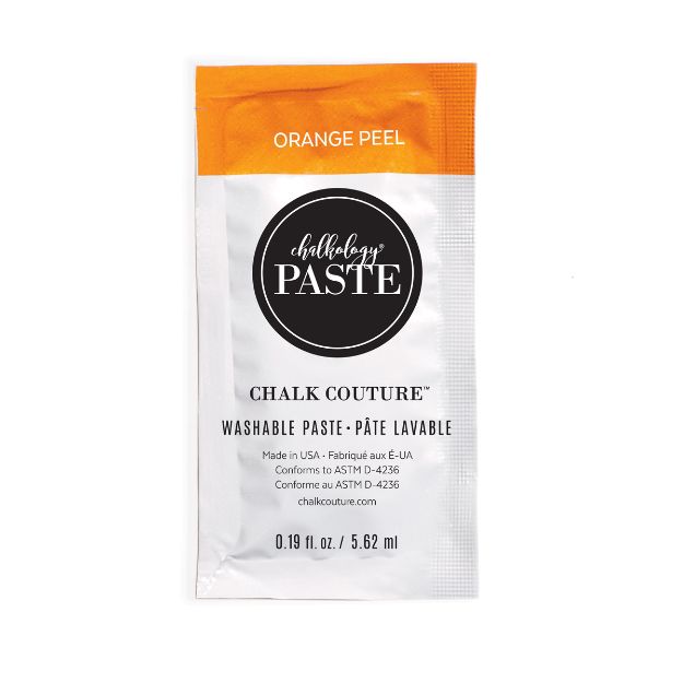 A single-use packet of Chalk Couture washable paste in the color "Orange Peel." The packet has an orange top section, a black circular logo, and product details in black text on a white background.