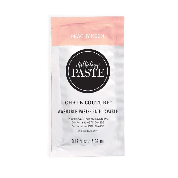 A small packet of Chalk Couture washable paste labeled "Peachy Keen." The packet is mostly white with a peach-colored top and black circular logo. The packet contains 0.19 fl oz (5.62 mL) of paste.