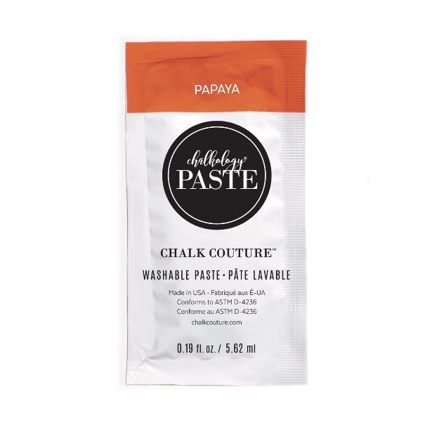 A small packet of Chalk Couture washable paste in the color "Papaya." The packet is mostly white with an orange top, black logo, and product information printed on the front. The packet contains 0.19 fl oz (5.62 mL).