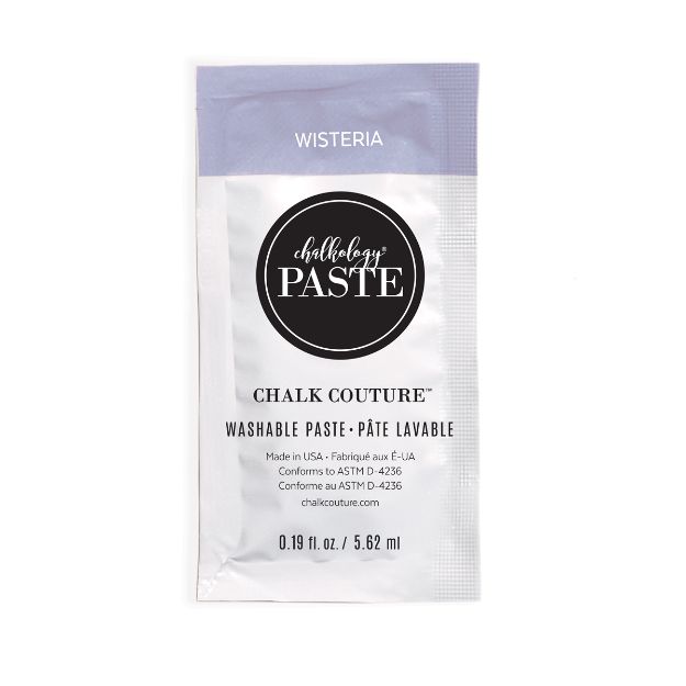 A small, sealed packet of Chalk Couture Chalkology Paste in the color "Wisteria." The packet has a purple top section and white bottom section, displaying product details and a volume of 0.19 fl oz (5.62 ml).