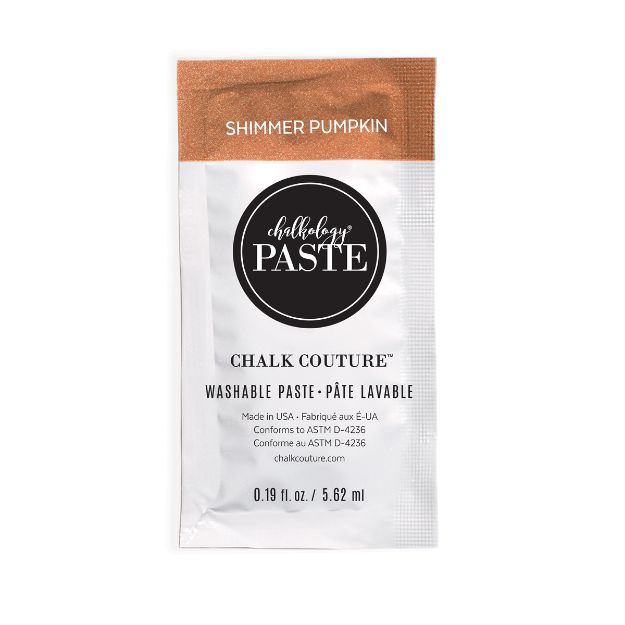 A small packet of Chalk Couture washable paste in the color "Shimmer Pumpkin." The front label displays product details in black and white with a copper-colored strip at the top. The packet contains 0.19 fl oz (5.62 ml).